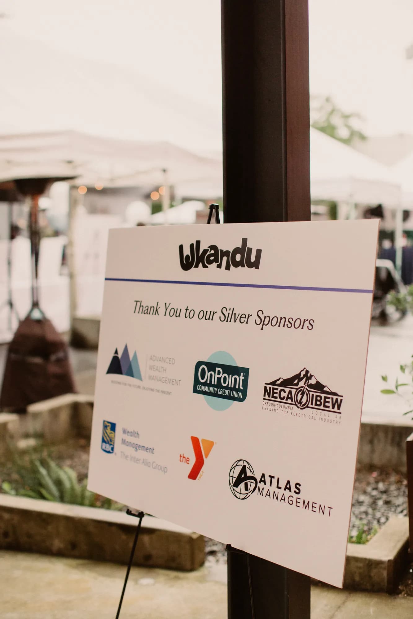 A sign thanking Ukandu's silver sponsors at Wine & Dine for Hope & Joy