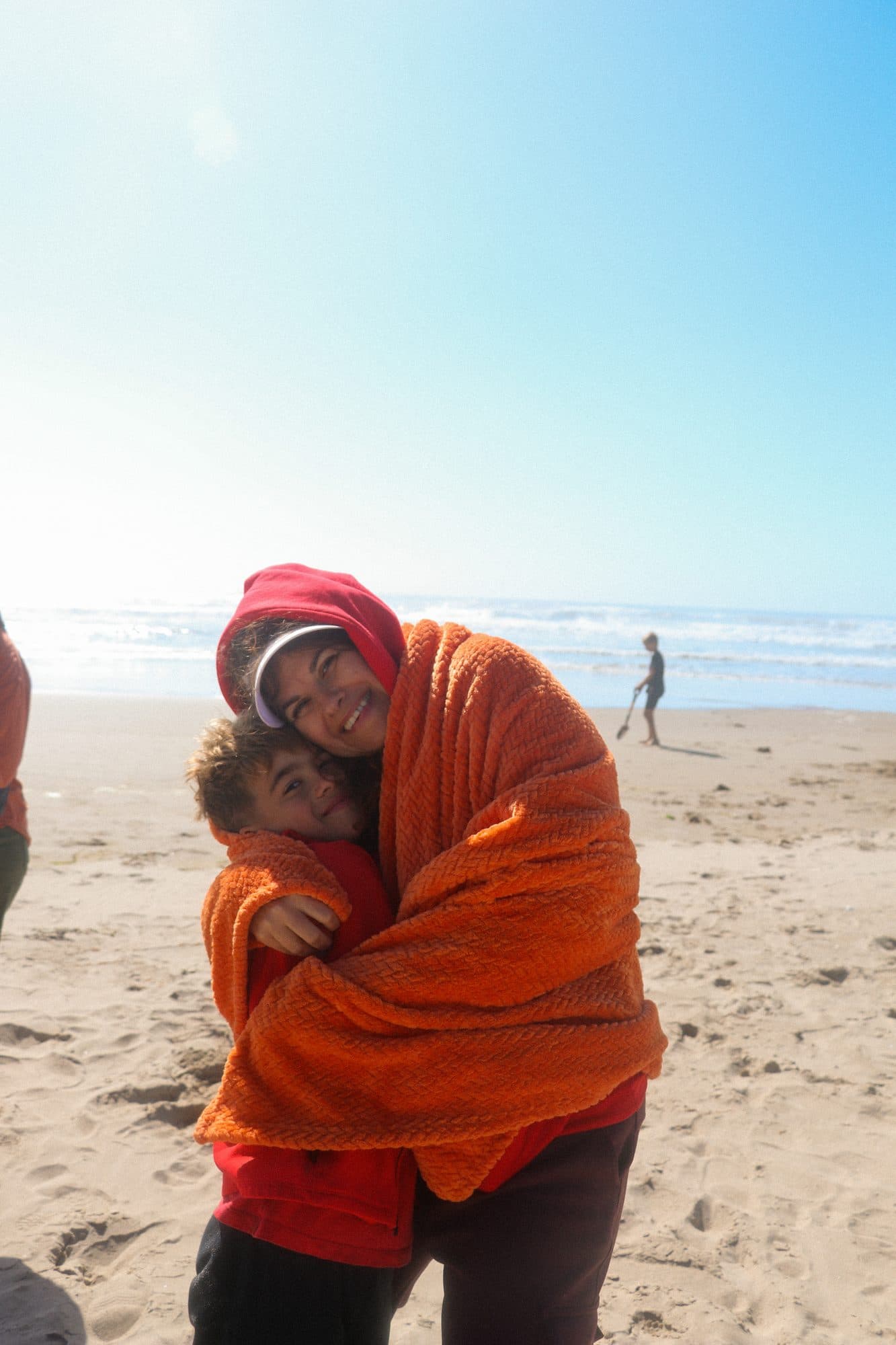 Two people embracing on the beach