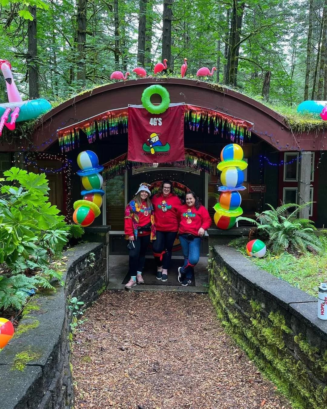 Volunteers in front of cabin